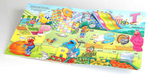Load image into Gallery viewer, Sesame Street: Elmo's ABC Lift-the-Flap by: Board Books; 10 pages / English
